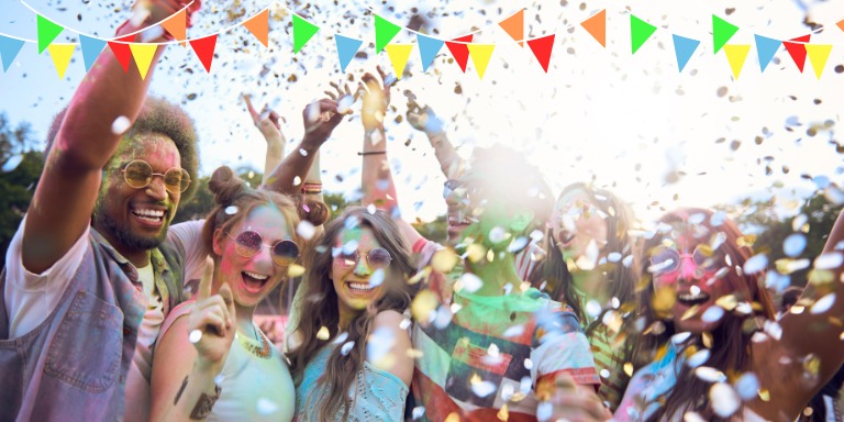 Photo of people celebrating with confetti.