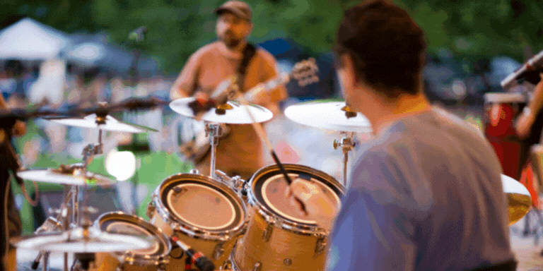 GIF of a band playing and a graphic that says 2025 Downtown Hayward Street Party