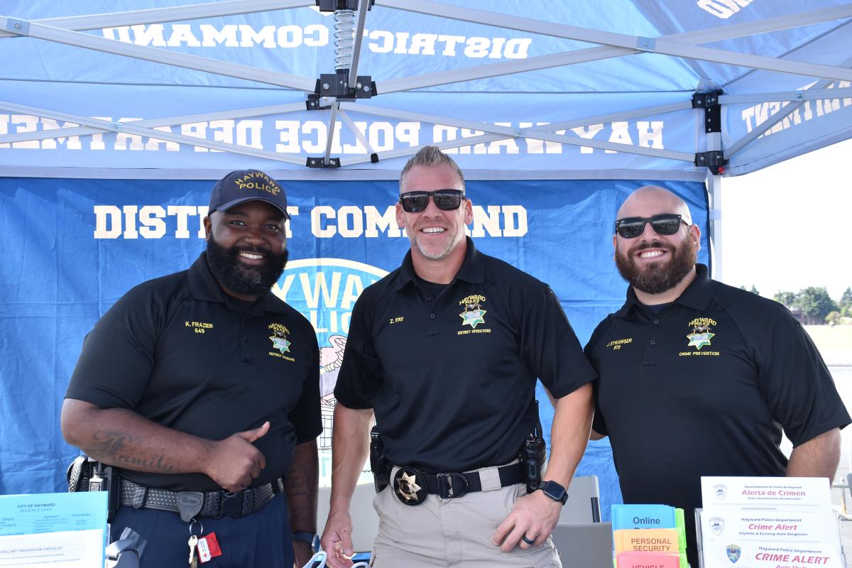 Police officers talking with a community member