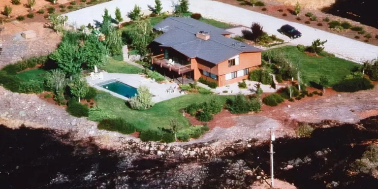 A home surrounded by burnt vegetation showing Zone 2: Reduced Fuel Zone (30-100 feet of to the property line)