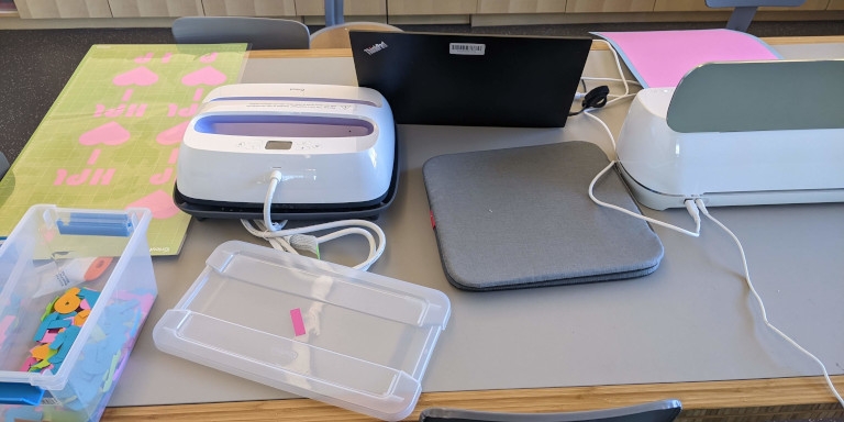 lamination equipment next to a cricket machine in the makerspace