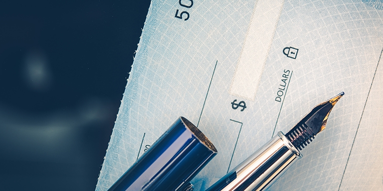 Issuing a blue check with a blue pen